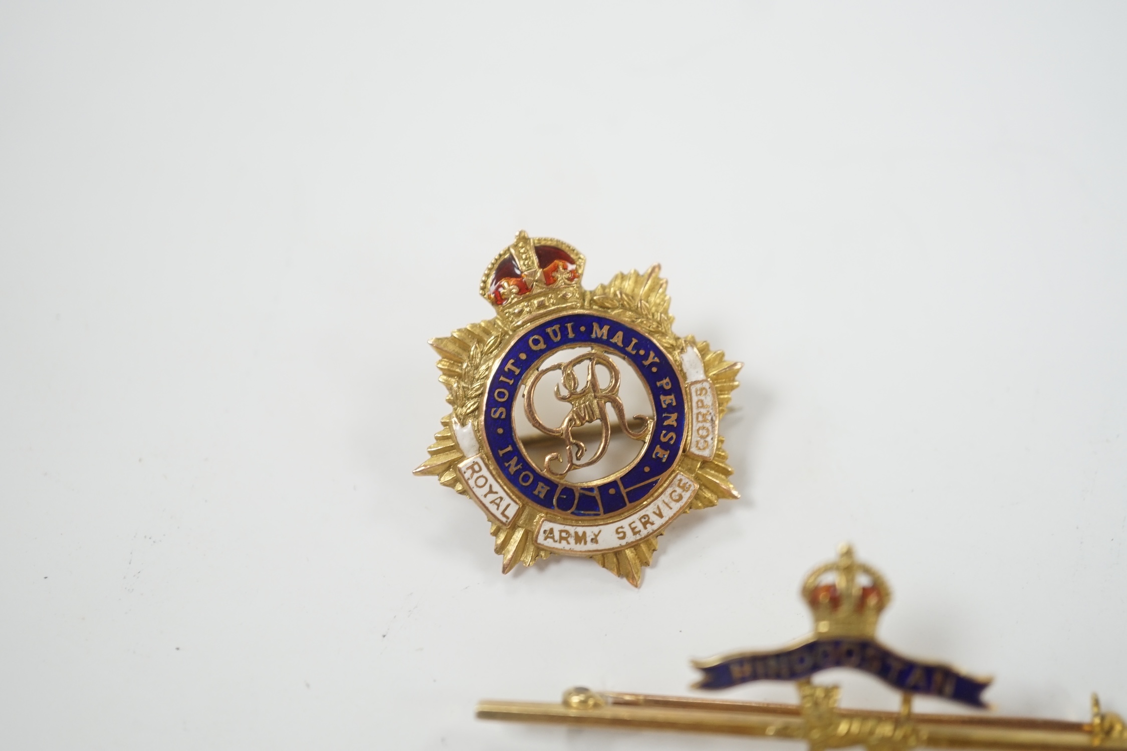 A 14ct and two colour enamel Royal Leicester Regiment sweethearts brooch, 50mm and a 9ct and enamel Royal Army Service Corps badge.